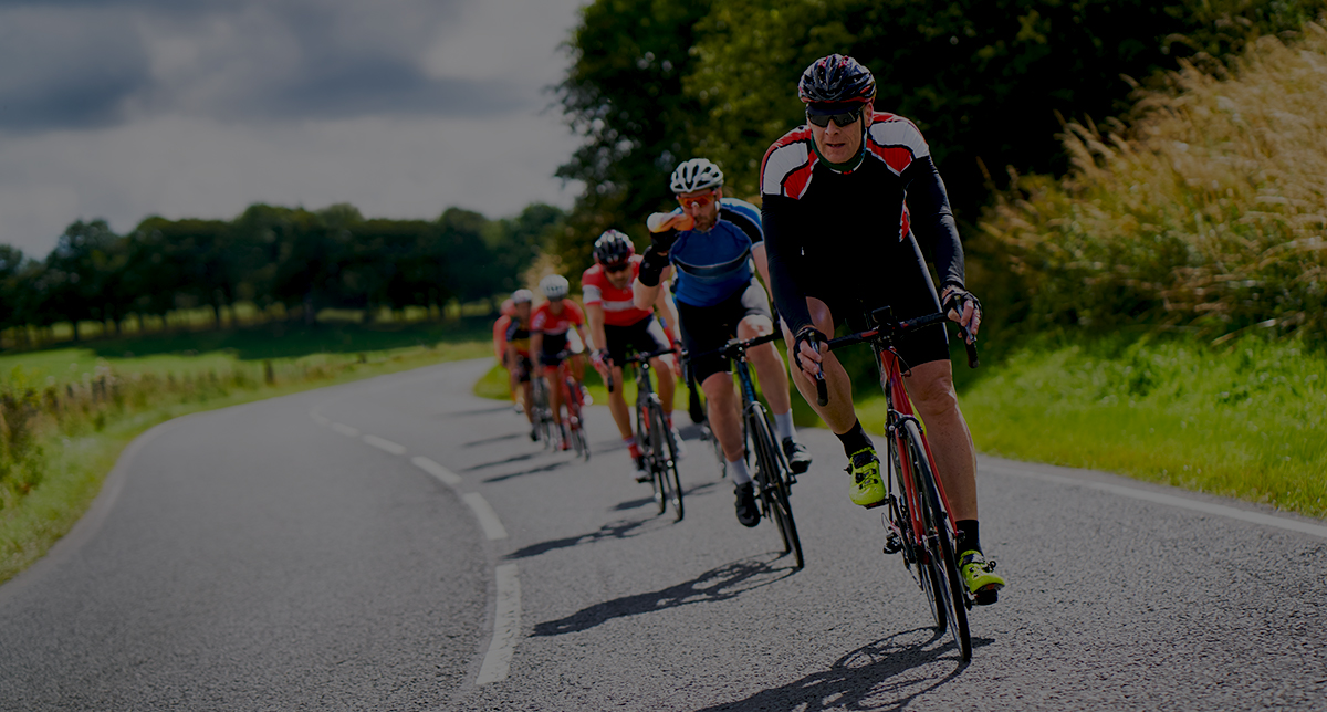 Alt text: An image of road cyclists in a paceline that represents how cloud accounting solutions can help streamline accounting data and how a cloud accounting software solution helps accounting professionals with tasks like inventory management and other financial processes.