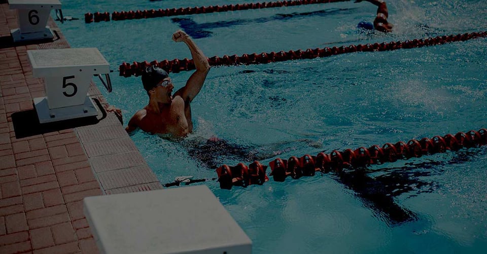 Swimmer finishing first representing efficiency and AI-driven automation in healthcare accounting