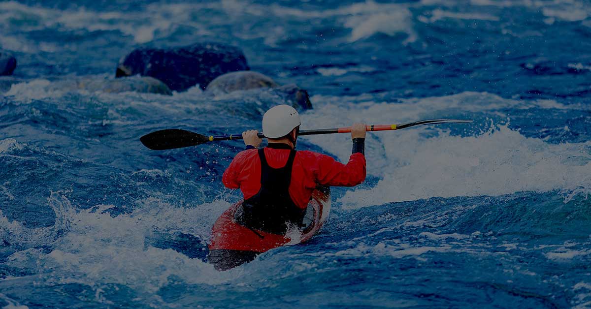 Kayaker navigating whitewater as a growing business prepares to upgrade its accounting software