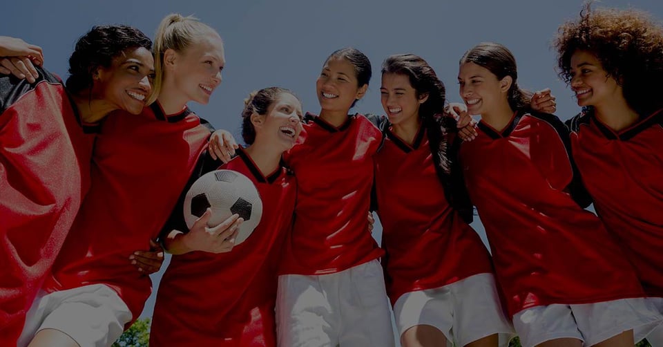 Women's soccer team representing teamwork and collaboration in multi-entity accounting.