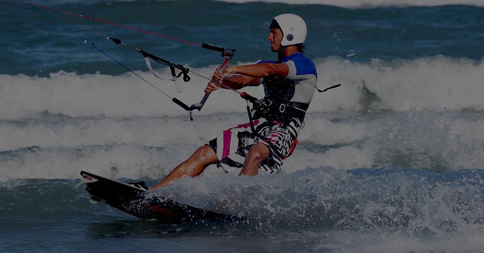 Kiteboarder navigating changing conditions representing financial reporting software for growing organizations