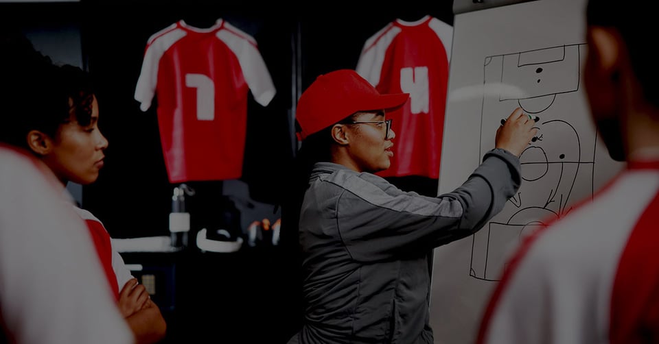 Coach helping an athlete prepare for the next level, representing a QuickBooks ProAdvisor guiding clients beyond QuickBooks to more advanced accounting software