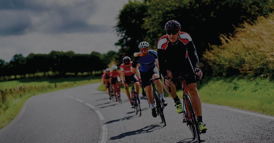 Cycling team riding in formation, symbolizing alignment and efficiency in sales order management workflows.